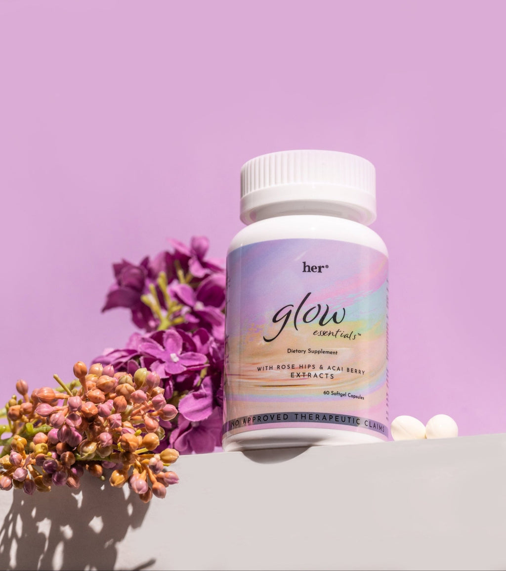 HER® Glow Essentials® capsule resting on a surface, with a detailed focus on the high-quality, traceable marine collagen and other active ingredients it contains.