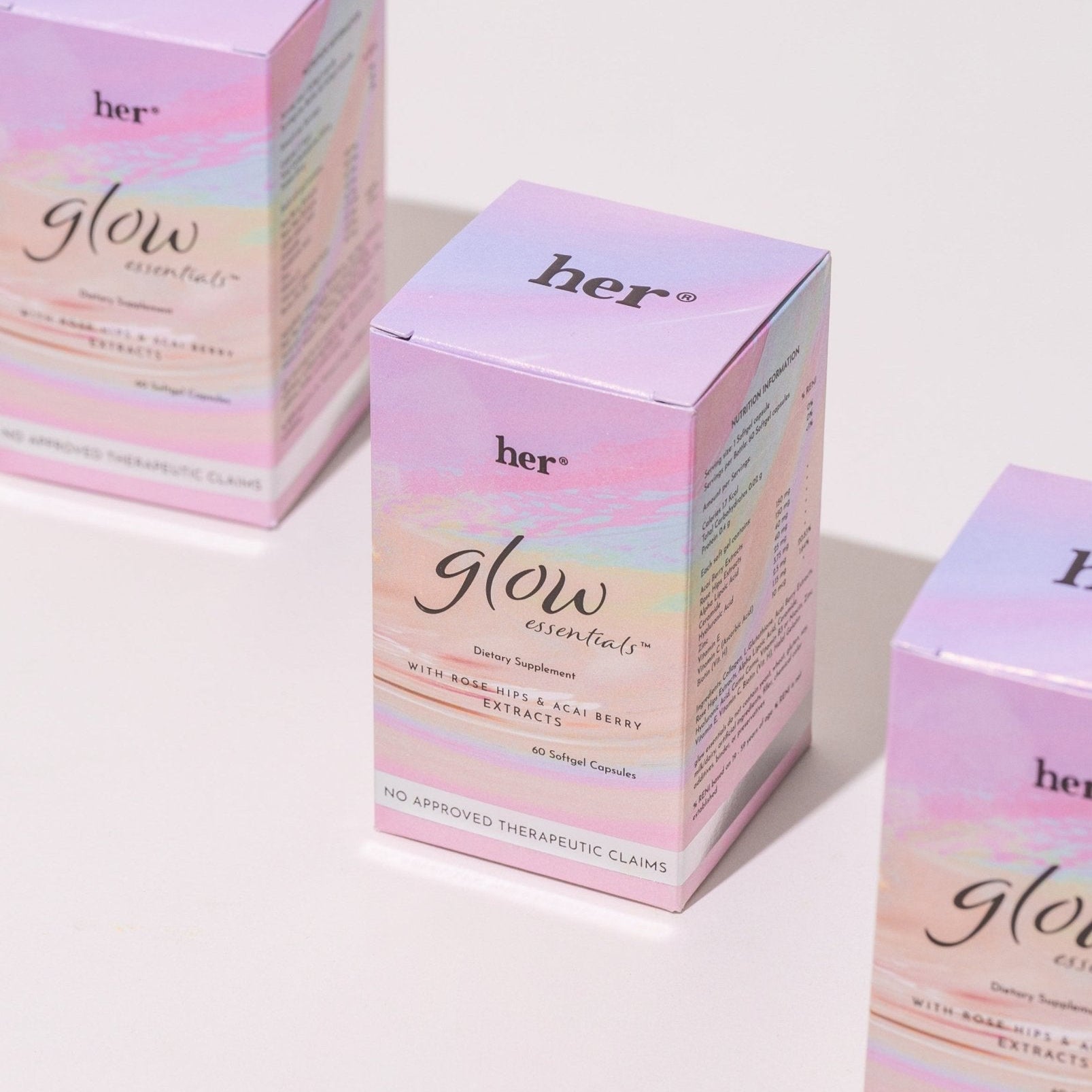 The HER® Glow Essentials® box  artfully arranged for a holistic self-care routine.